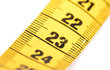 © michaklootwijk - Close-up of a yellow measuring tape isolated on white - 23