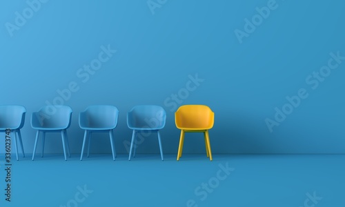 Fotografía Yellow chair standing out from the crowd
