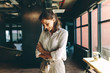 © Jacob Lund - Businesswoman looking happy in office