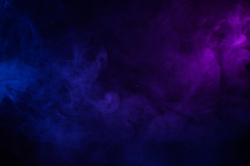 Poster - Soft clouds of colorful smoke dark abstract backgound