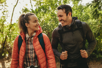 happy couple enjoying on their hiking trip