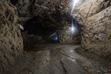 Underground gold quartz mine shaft tunnel drift with light