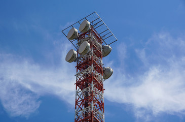 Telecommunication tower with a sunlight. Used to transmit television signals.