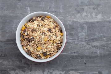 Sticker - dry muesli in the bowl on ceramic background