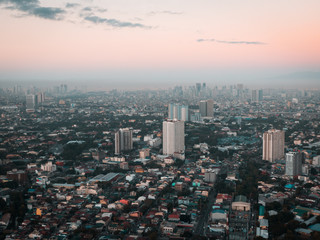 Wall Mural - Aerial Cityscape of Metro Manila in the Philippines while sunrise