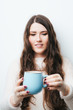 © aeroking - brunette girl drinking coffee or tea on a white background