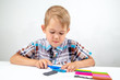 © vitec40 - the boy is engaged in modeling plasticine, cuts plasticine with a knife