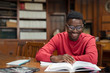 © Rido - Happy university student reading in library