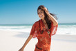 © Rido - Happy fashion woman running on beach