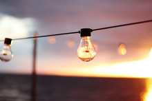 String Lights During Sunset. Sea Background. Abstract Background. 