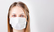 Woman with medical mask on face. Protection against viruses and infections. Stay home, corona virus.