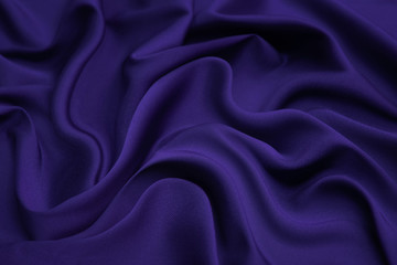 Wall Mural - Purple fabric background and texture. Crumpled of violet satin for abstract and design