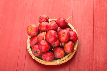 Canvas Print - Red Hawthorn Berries on wooden table.