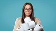 © South House Studio - Cute woman holds bunch of bills with toilet paper, she smiles with a joy