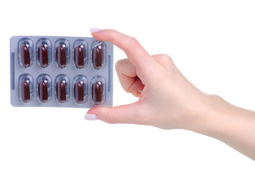 Sticker - blister brown pills capsules in hand medicine pharmacy on white background isolation