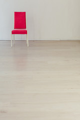 Sticker - pink chair in the interior of an empty white room