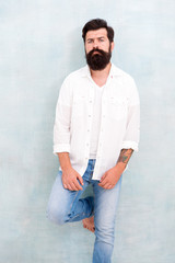 Summer fashion. Bearded model casual outfit. Fashion model. Mature handsome hipster with beard wear white shirt. Summer collection. Menswear concept. Fashion clothes. Attractive guy wall background