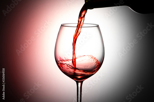 red wine pouring into glass Canvas Print