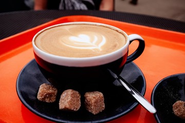 Close up  of foam over coffee cup .