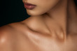 © Edgar Martirosyan - woman's neck and lips on a dark background