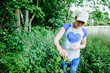 © Jennifer - Teen girl picking wild black raspberries along a fence row in Michigan