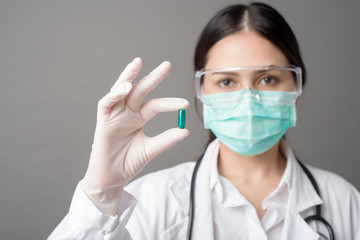 Intelligent Doctor is holding medicine pill