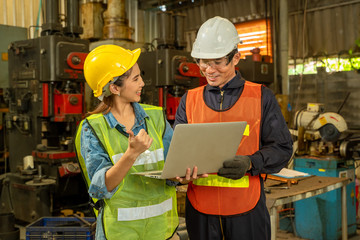 Poster - Two engineer in hard hat wearing safety using laptop for planning a project at factory site.