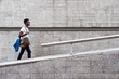 © Santi Nunez/Stocksy - Young man walking outdoors