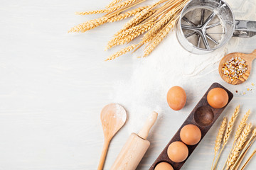 Wall Mural - Baking ingredients and kitchen utensils flat lay. Healthy eating, home cooking, baking recipes, online cooking blog and classes concept