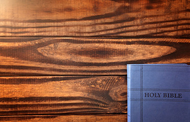 Wall Mural - A Background with a Bible on a Rustic Wooden Table