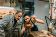 © MyMicrostock/Stocksy - Luthiers working in traditional guitar making business