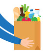 © StockVector - Paper bag full of products, grocery delivery service concept.