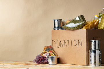 Wall Mural - Food donations on the table. Text Donation. Close up.