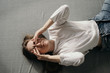 © Sergey Filimonov/Stocksy - Tired woman rubbing closed eyes