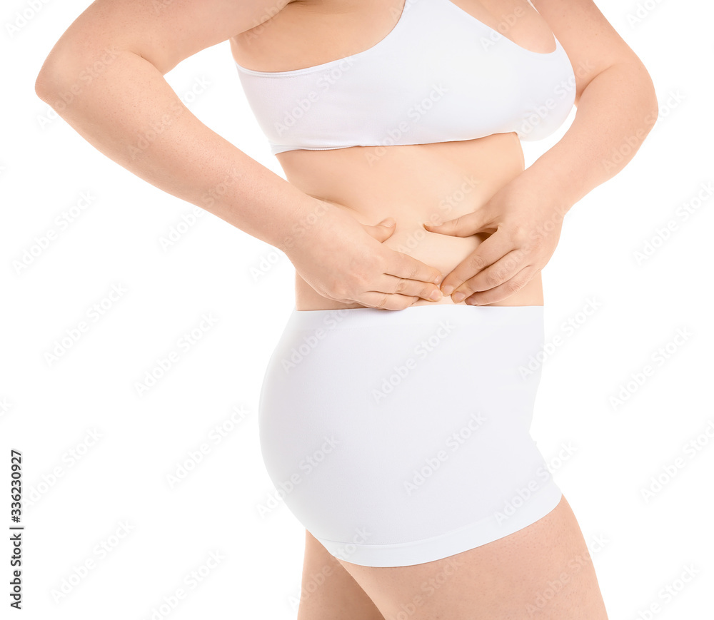 Overweight woman on white background. Weight loss concept