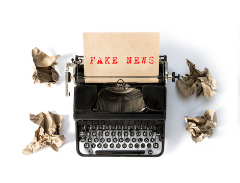 Antique typewriter with paper Fake news