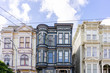 © David Keller/Stocksy - A group of three vintage apartment buildings in downtown san Francisco