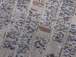 © Laika One/Stocksy - Aerial view of cars parked at parking lot