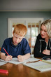 © Gabriel (Gabi) Bucataru/Stocksy - Mom and Son Homework