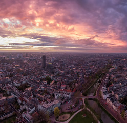 Wall Mural - Aerial of Utrecht historic city center with the Dom church during impressive sunset with fire colour clouds