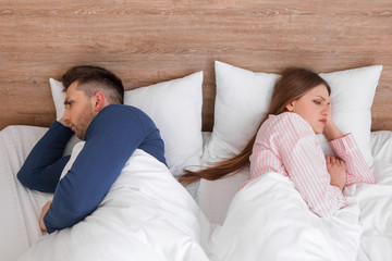 Sticker - Sad couple after quarrel in bedroom