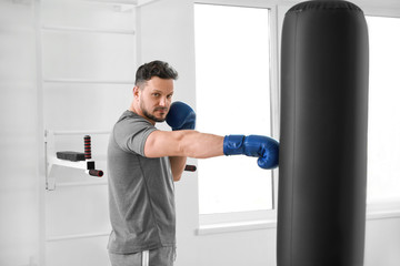 Wall Mural - Male boxer training in gym