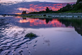 Fototapeta  - Sunset Reflects in Low Tide at Discovery Park in Seattle