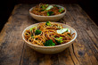 © Westend61 - Bowls of Japanese?soba?noodles with?bok?choy, broccolies, soy sauce and black sesame