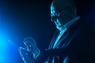 Poster - a man with a smartphone. concept - businessman makes a decision.