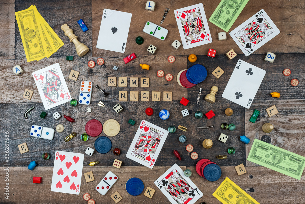 Top view of board game pieces on a wood table Stock Photo | Adobe Stock