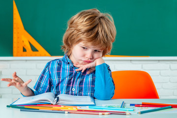 Poster - Child home studying and home education. School kids against green chalkboard. Home school for pupil. Elementary school classroom.