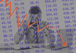 © SB Arts Media - Strong image of market chart over depressed man affected by COVID-19 impact on stock market crash.