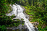Fototapeta Nowy Jork - Beautiful waterfall near the rock in Rio de Janeiro's Tijuca Forrest in Brazil