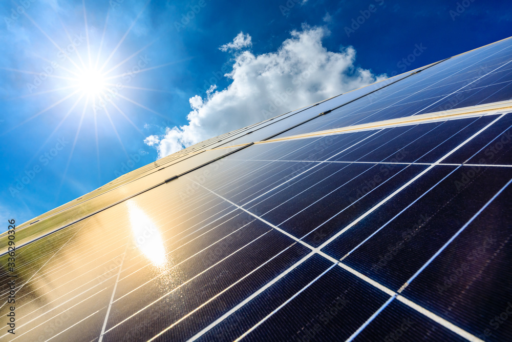 Photovoltaic solar power panel on sky background,green clean alternative energy concept. - obrazy, fototapety, plakaty 